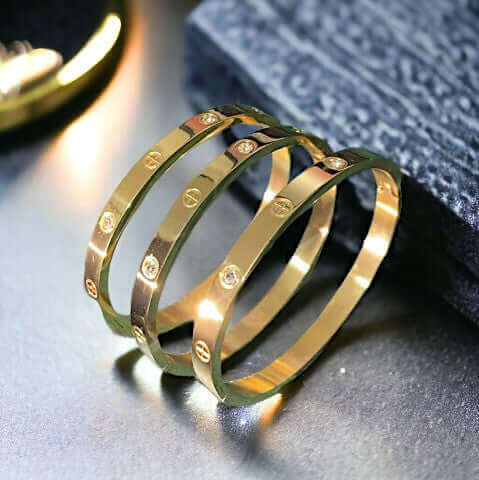 Close-up of the stone setting on gold stainless steel cuff bracelet with zirconia stones