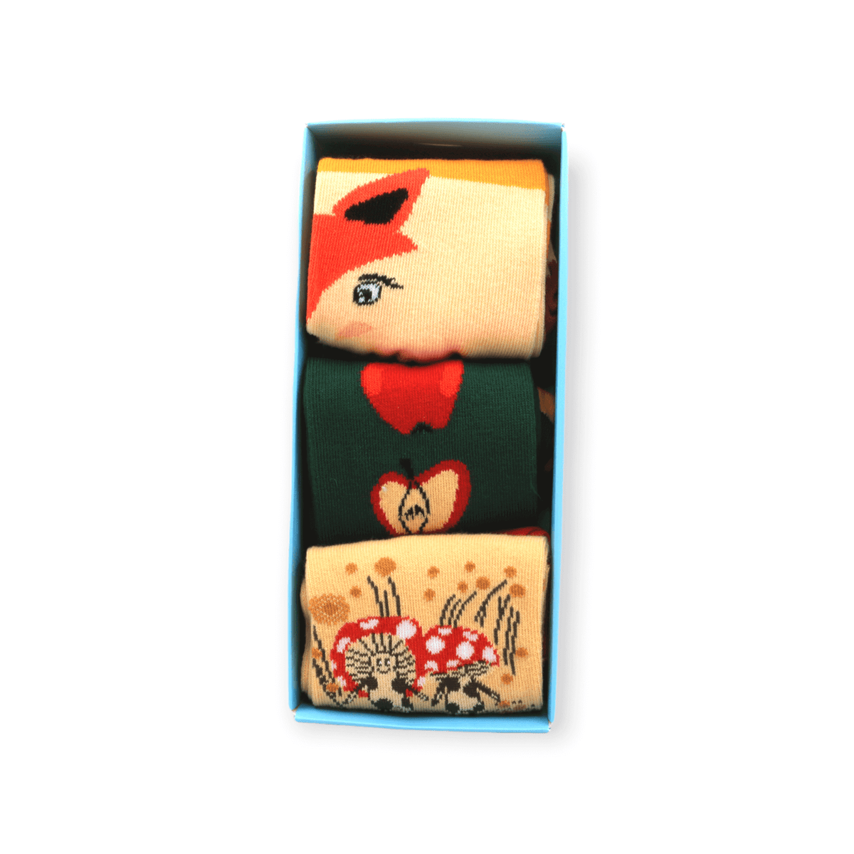 Underfoot view of unisex three-pack socks box set with fox apple and mushroom designs