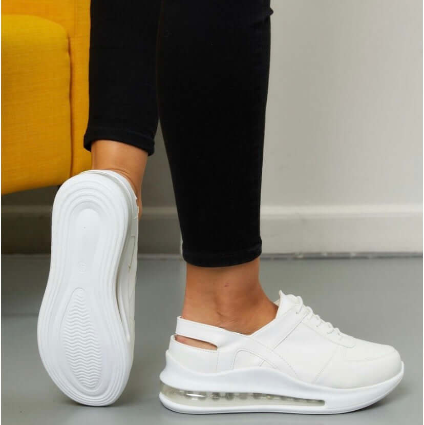 Heel and back view of handmade white leather sneaker clogs with a Supermax sole