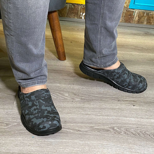 Side profile of camouflage print leather clogs with an ergonomic Comfortflex sole