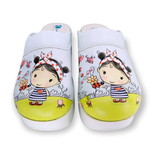 Side profile of handmade little girl design leather clogs with an Air Clogx sole