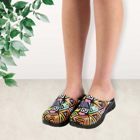 Side profile of handmade unisex colourful leather clogs with a Comfortflex sole
