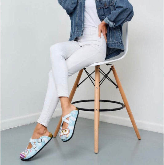 Blue owl leather cork sole clogs seen in side profile