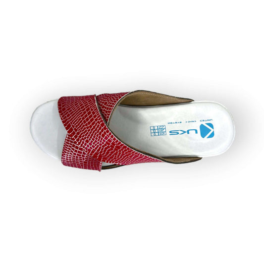 Side profile of red and silver cross band leather clogs with an Air Clogx sole