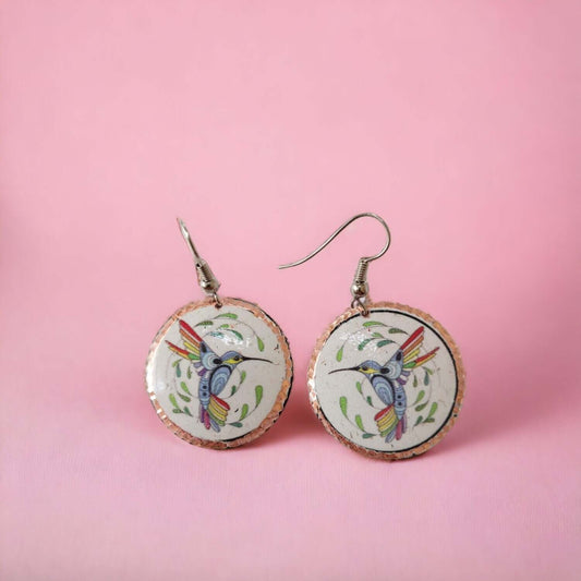 Close-up of the copper texture on handcrafted hummingbird copper circle earrings