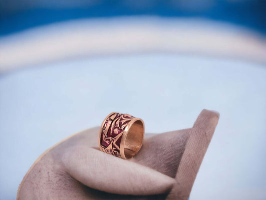 Close-up of the copper texture on handmade magenta wrinkled copper adjustable ring