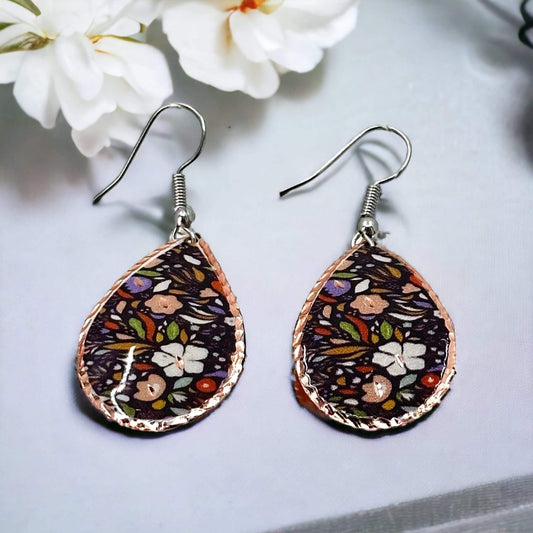 Front view of three-piece purple and white flowers copper jewellery set