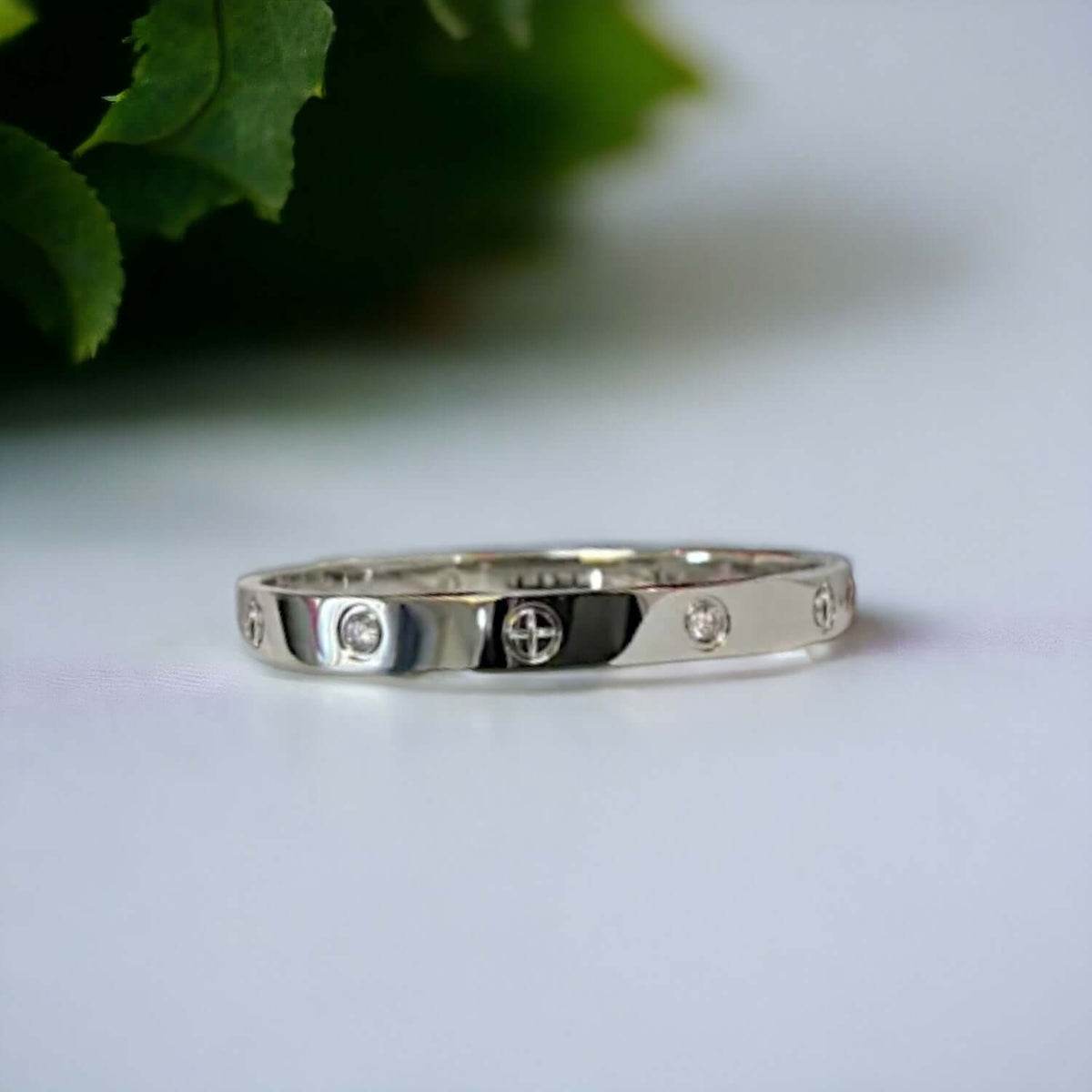 Side angle of silver stainless steel cuff bracelet with zirconia stones