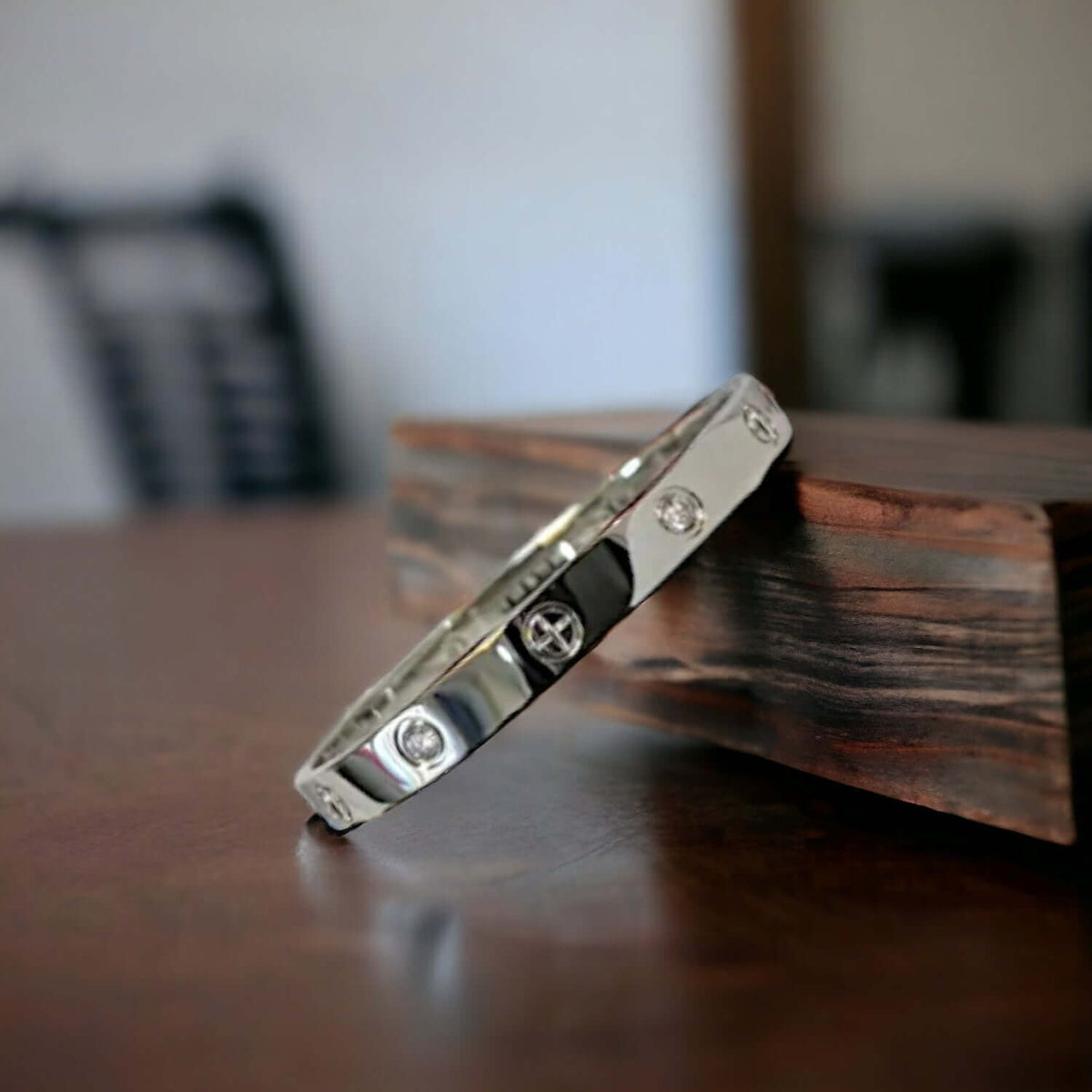 Close-up of the stone setting on silver stainless steel cuff bracelet with zirconia stones