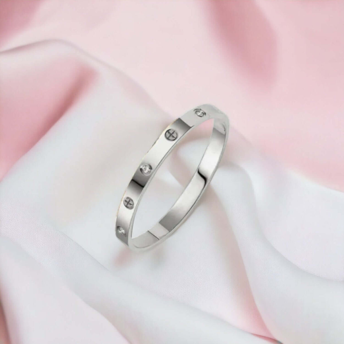 Silver stainless steel cuff bracelet with zirconia stones worn on the wrist
