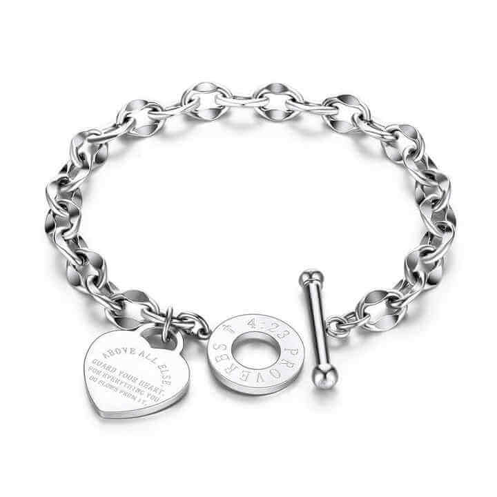 Heart charm chain bracelet with a steel toggle clasp displayed on a plain background