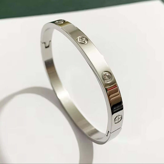 Front view of silver stainless steel cuff bracelet with zirconia stones