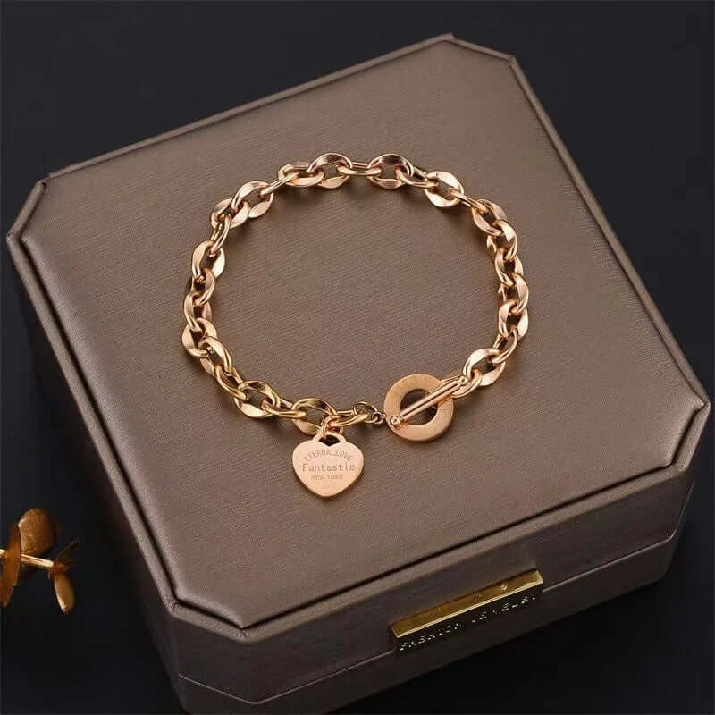 Close-up of the surface finish on heart charm chain bracelet with a steel toggle clasp