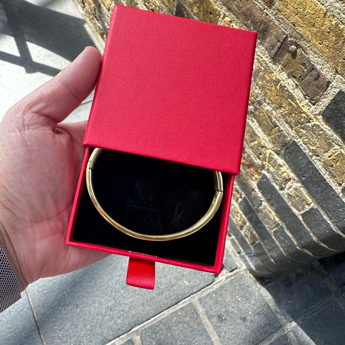Gold plated stainless steel couple bangle shown on a model