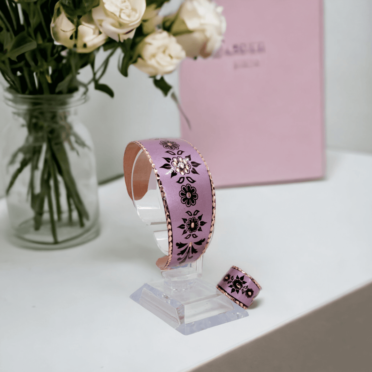 The full adjustable lavender copper ring and bracelet set laid flat