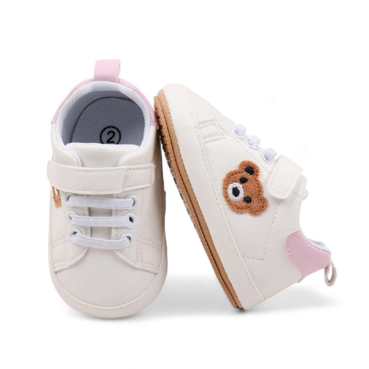 Side profile of pink teddy bear baby sneakers with a soft sole