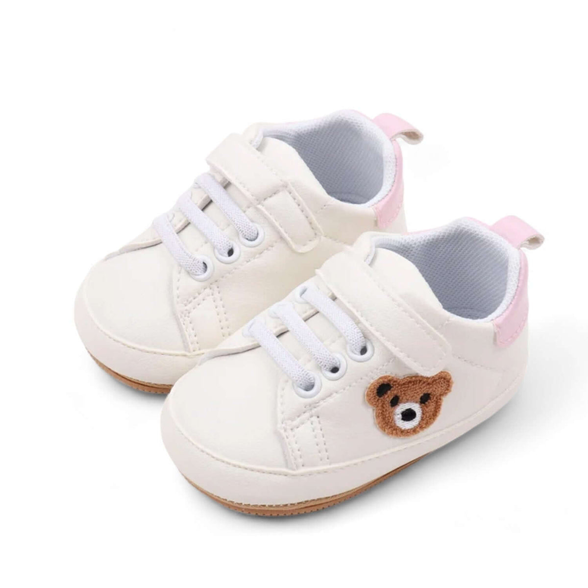Sole and tread detail of pink teddy bear baby sneakers with a soft sole