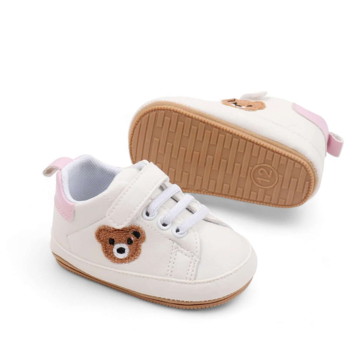 Footbed detail of pink teddy bear baby sneakers with a soft sole