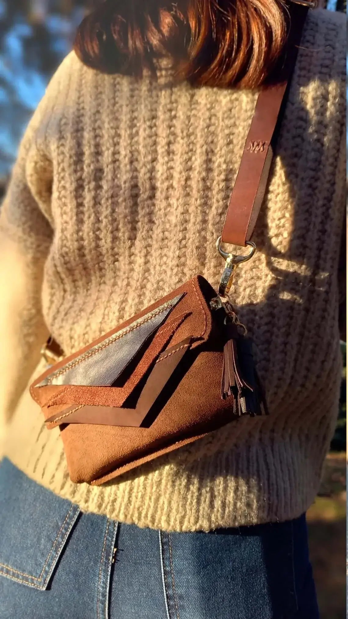 Side profile of triangle brown leather belt bum bag in style 01
