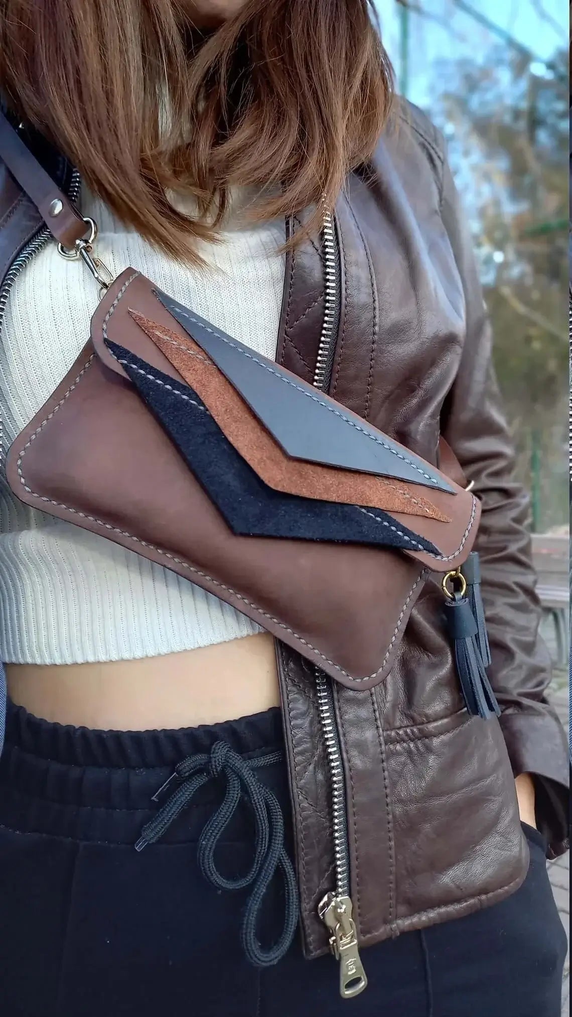 Close-up of the leather grain on triangle brown leather belt bum bag