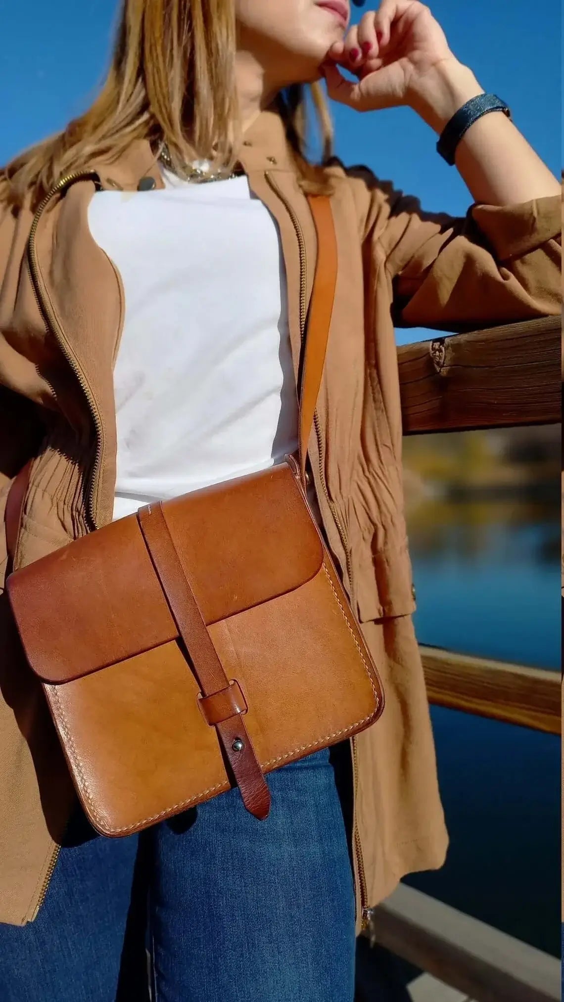 Close-up of the stitching on genuine tan leather belt bum bag