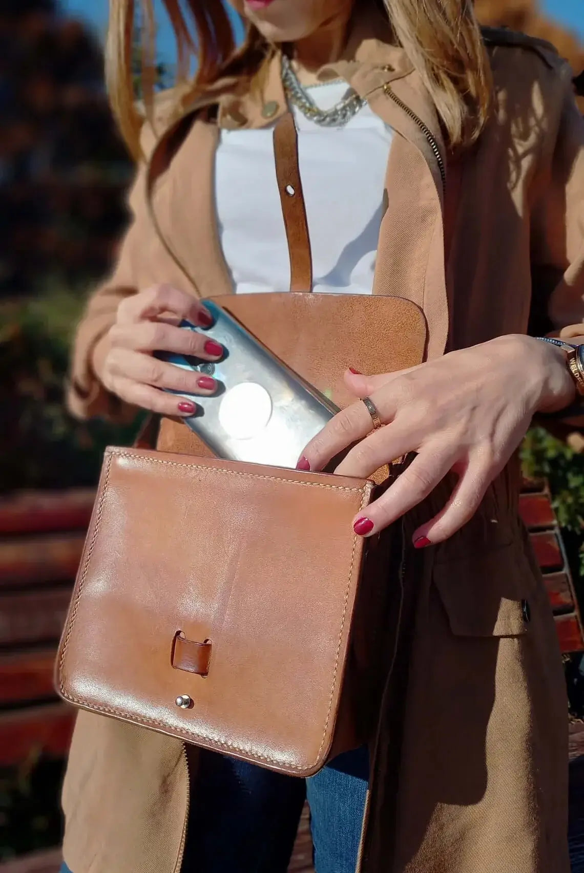 Strap and fastening detail on genuine tan leather belt bum bag
