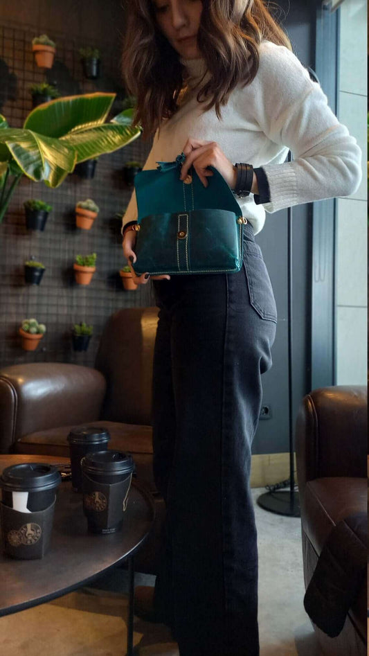 Side profile of handmade blue leather waist bum bag