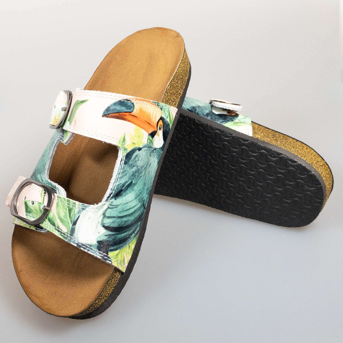 Footbed detail of tropical print double band open toe leather sandals