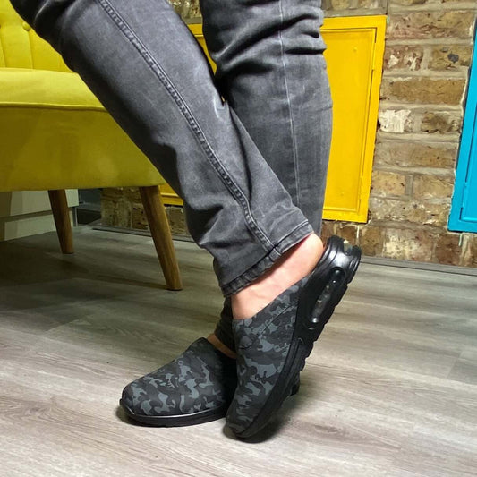 Front view of camouflage leather clogs with a light Air Clogx sole