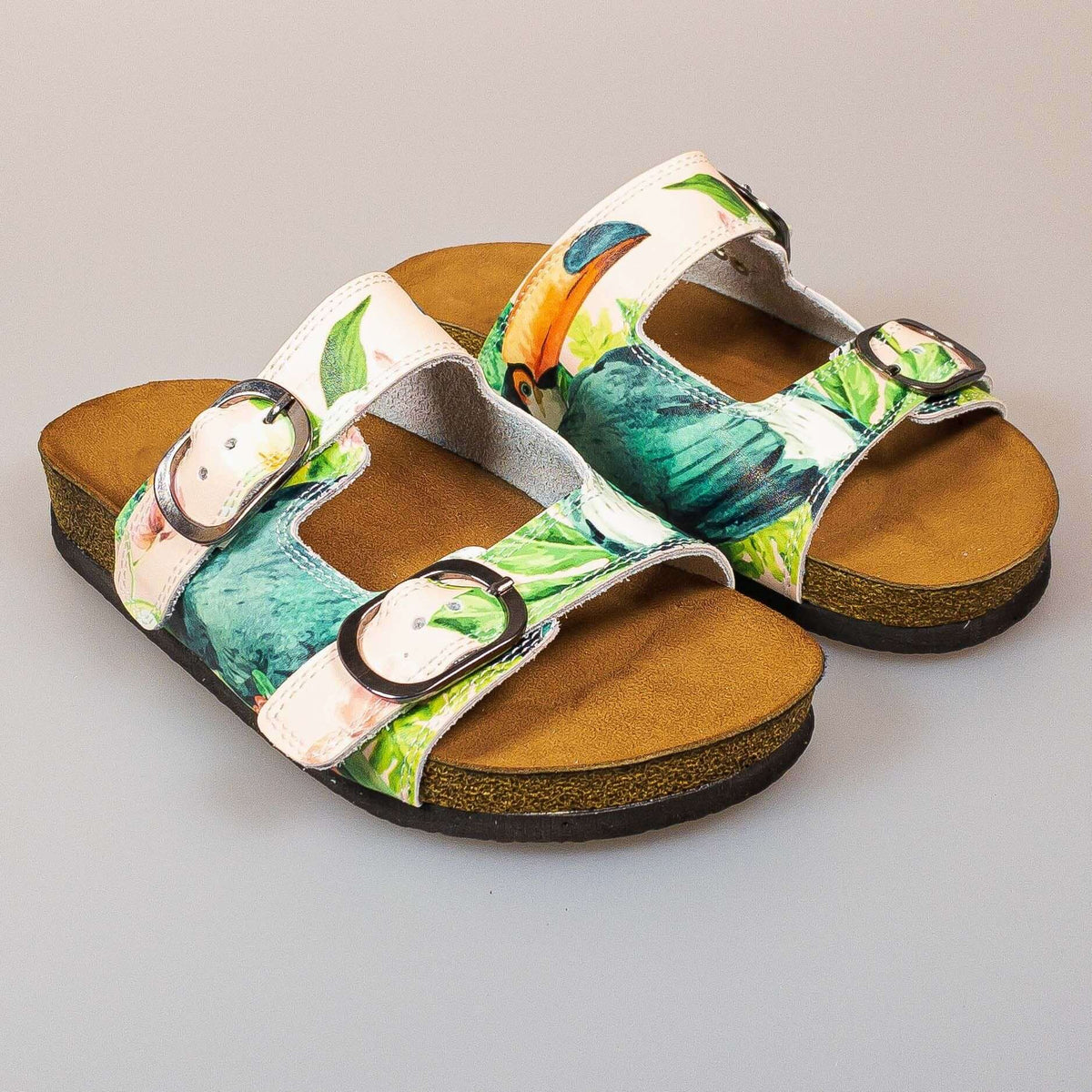 Strap and buckle detail on tropical print double band open toe leather sandals
