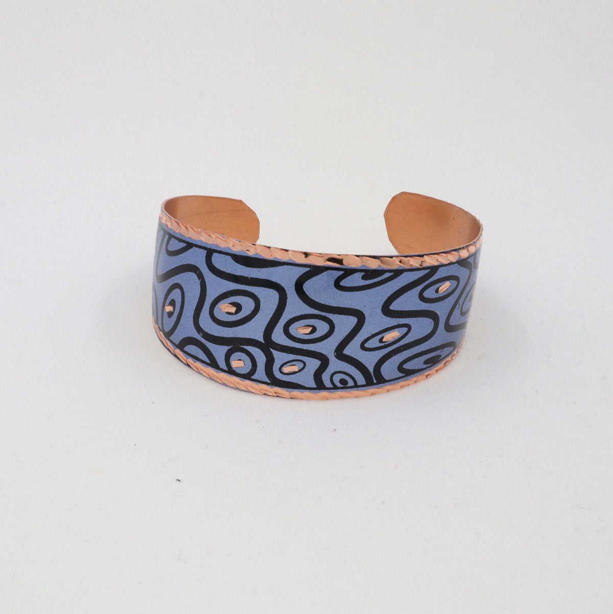 Angled view of handcrafted blue curvy copper statement jewellery set