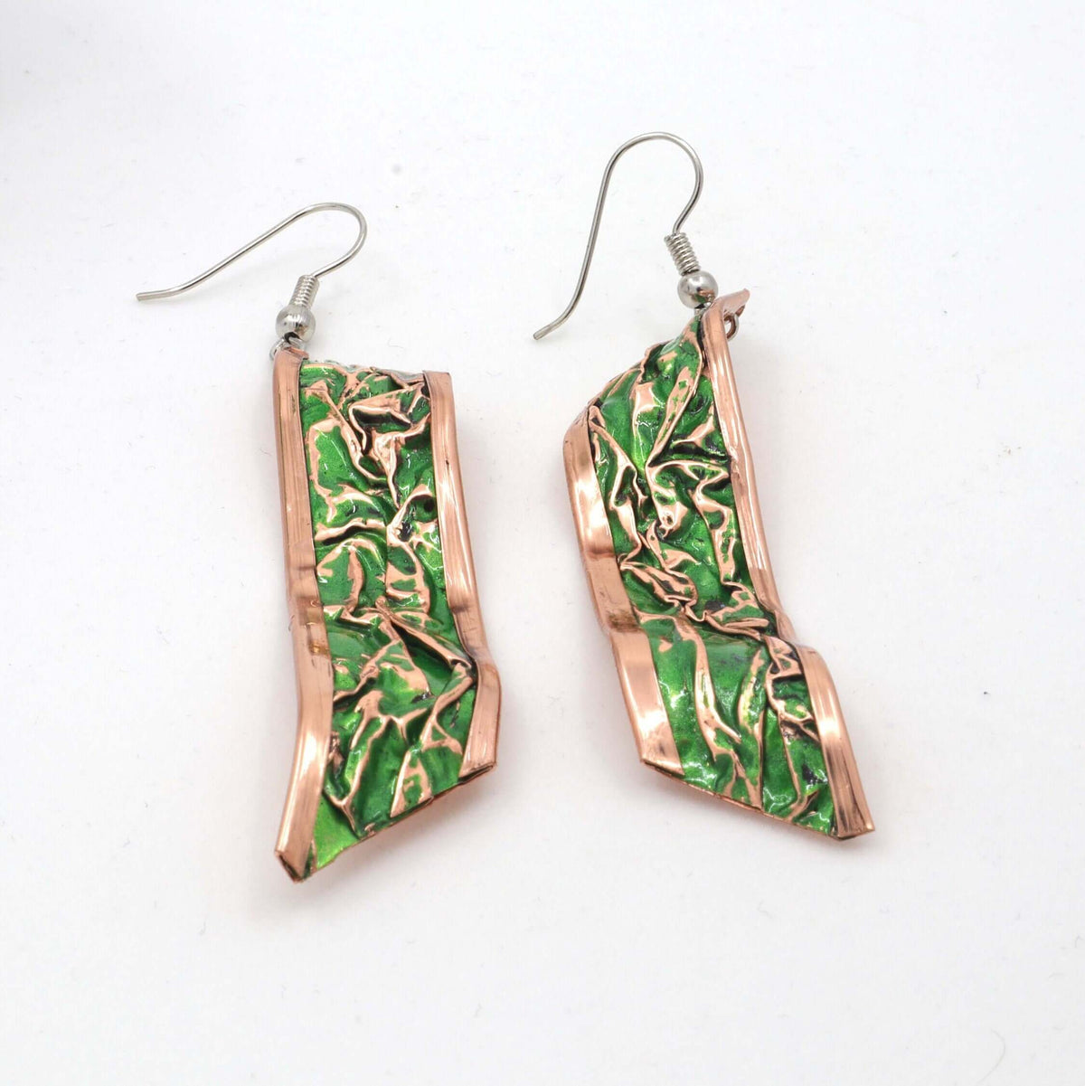 Close-up of one piece from complete green wrinkled copper jewellery set
