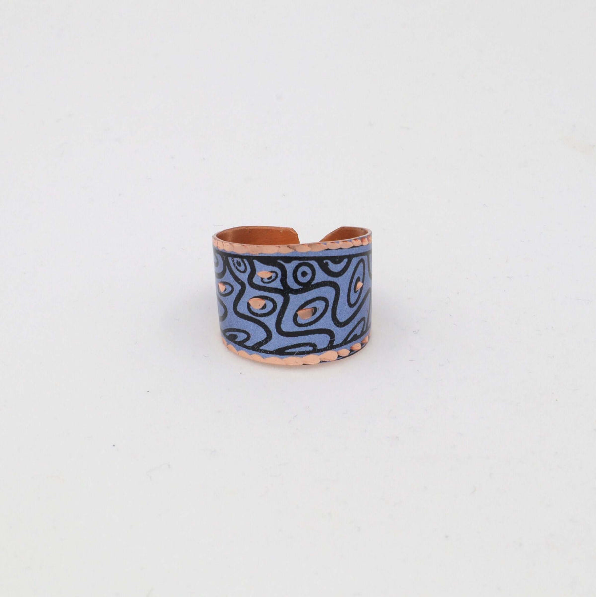Handcrafted blue curvy copper statement jewellery set displayed on a plain background