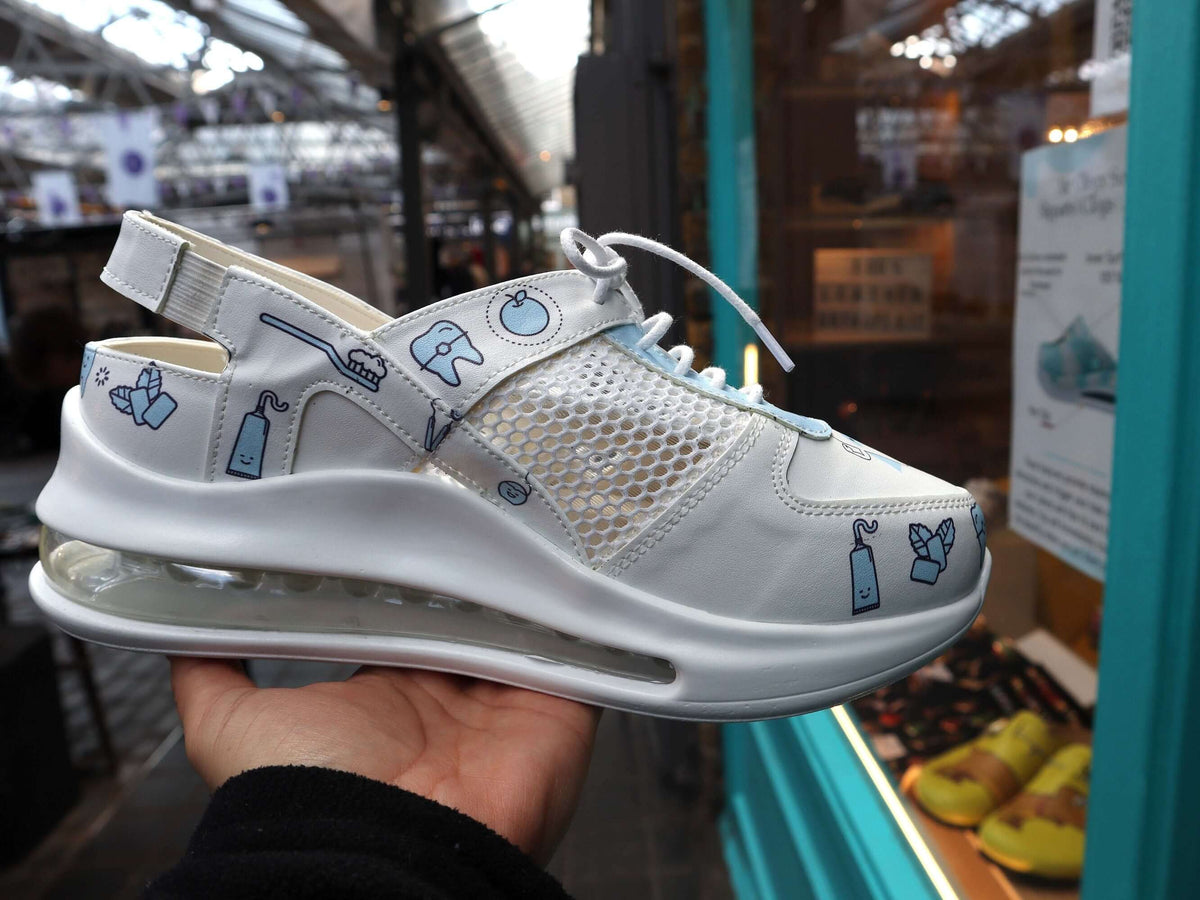 Side profile of dentist design leather nursing sneaker clogs with a Supermax sole