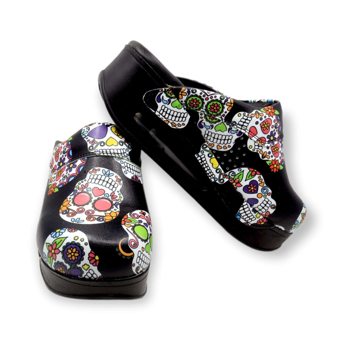 Top-down view of handmade skull and flower leather clogs with an Air Clogx sole