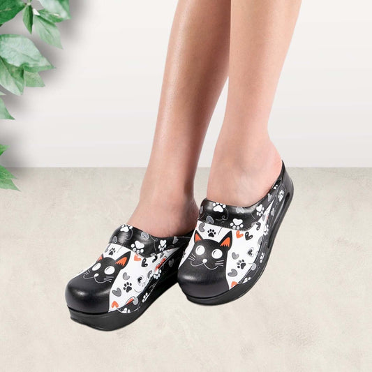 Front view of handmade black cat design leather clog slippers with an Air Clogx sole