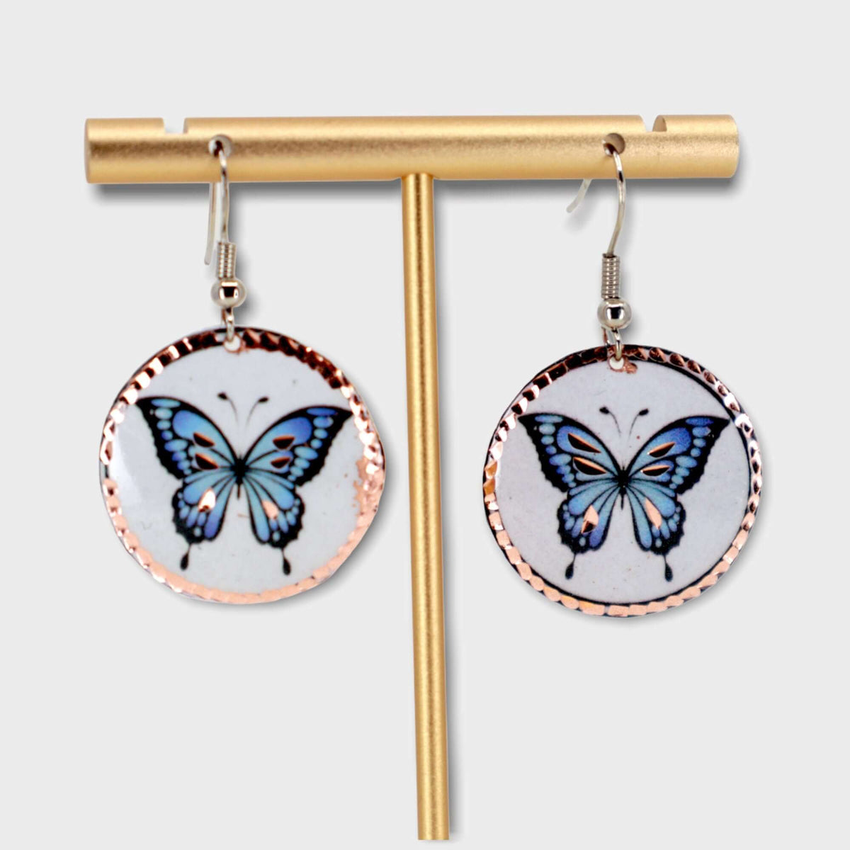 Back view of handcrafted butterfly copper circle earrings