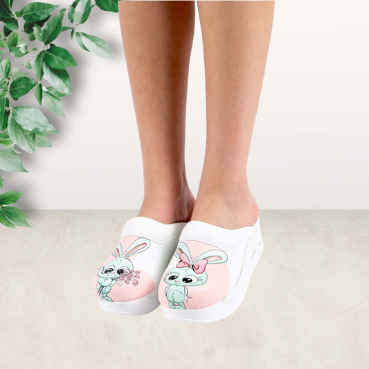 Side profile of handmade bunny design leather clog slippers with an Air Clogx sole