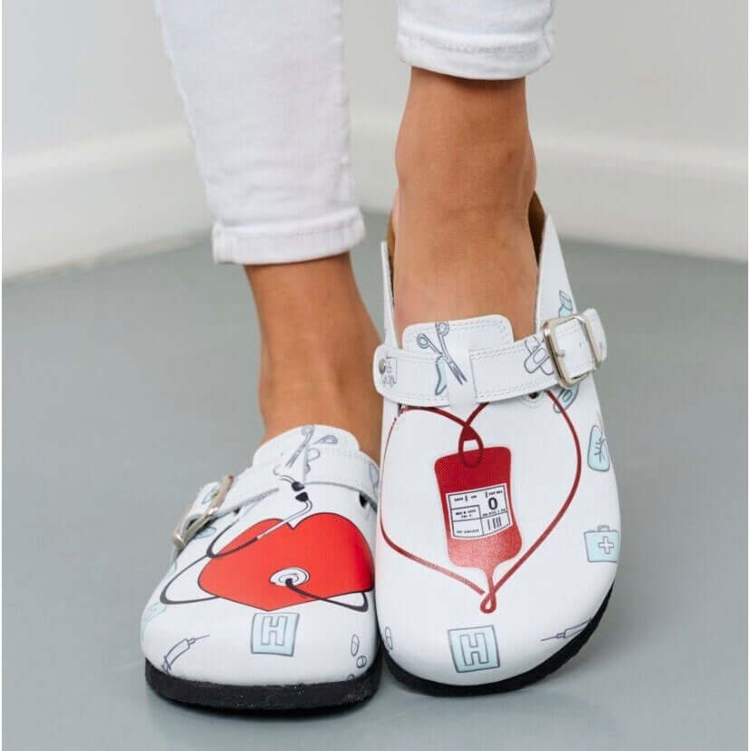Nurse print leather cork sole clogs seen in side profile
