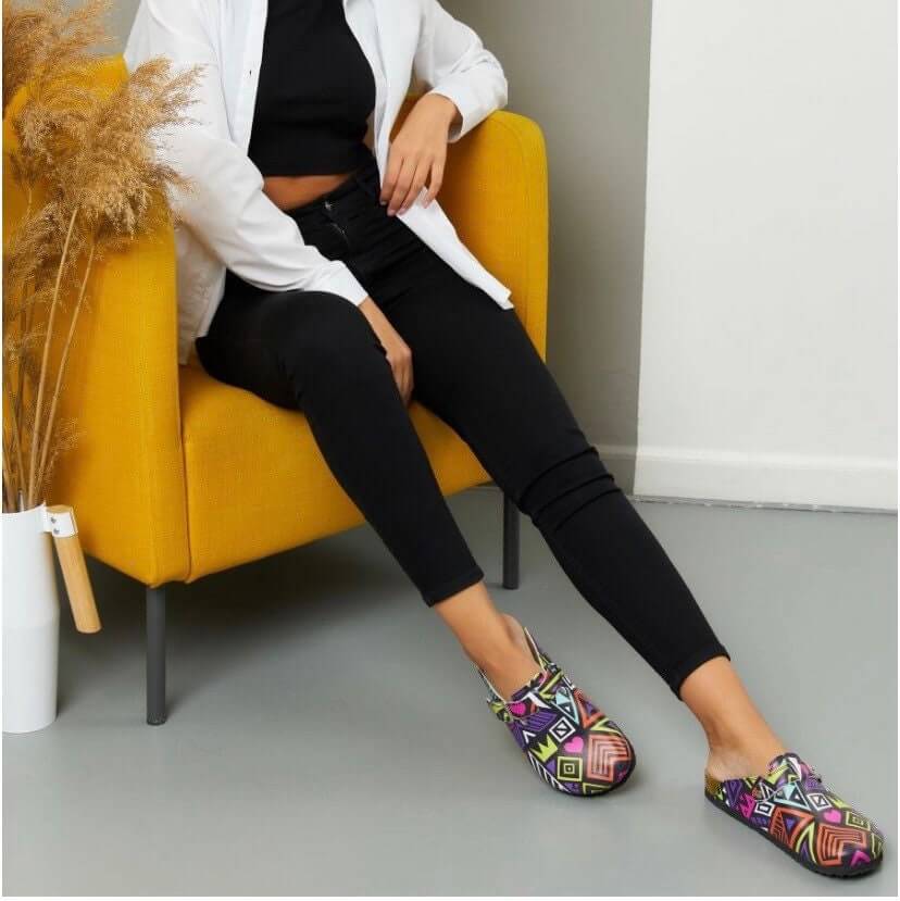 Pair of colourful leather cork sole clogs side by side