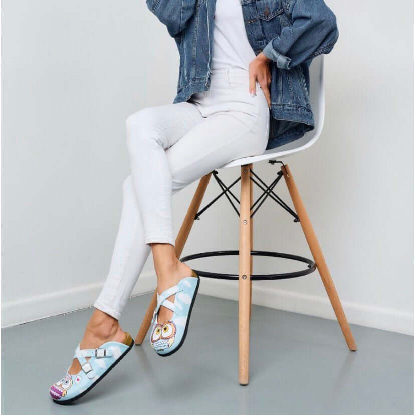 Blue owl leather cork sole clogs seen in side profile