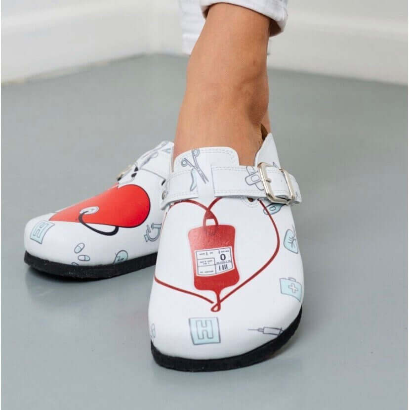 Leather strap detail on the nurse print cork sole clogs