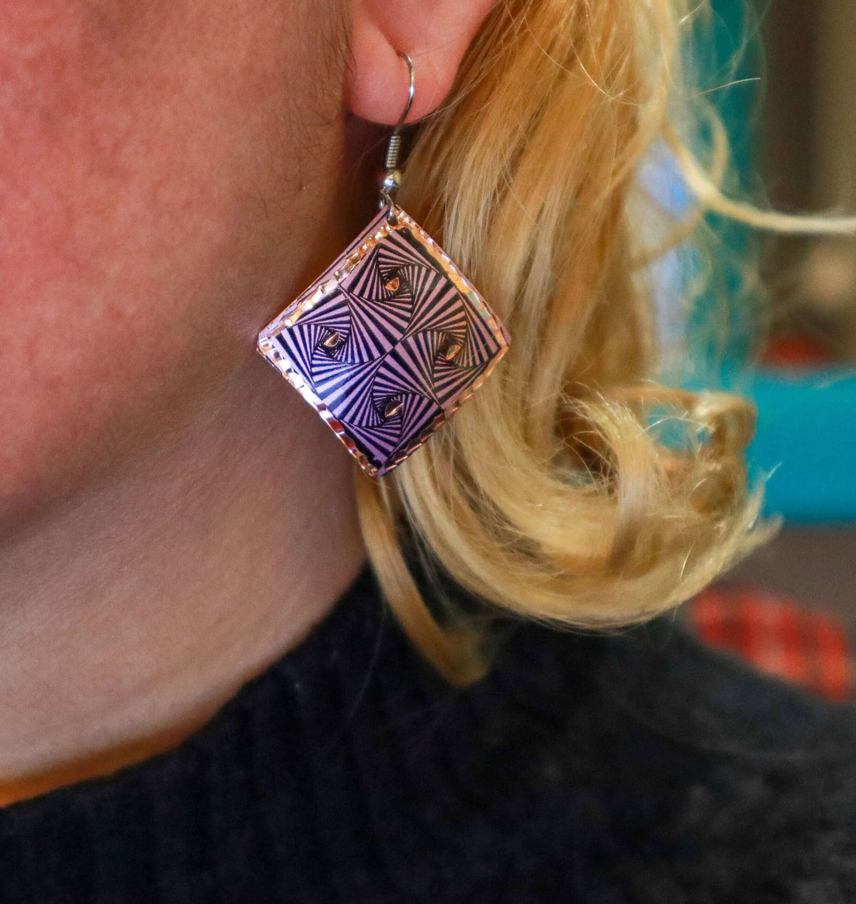 Front view of artisan purple geometric copper square earrings
