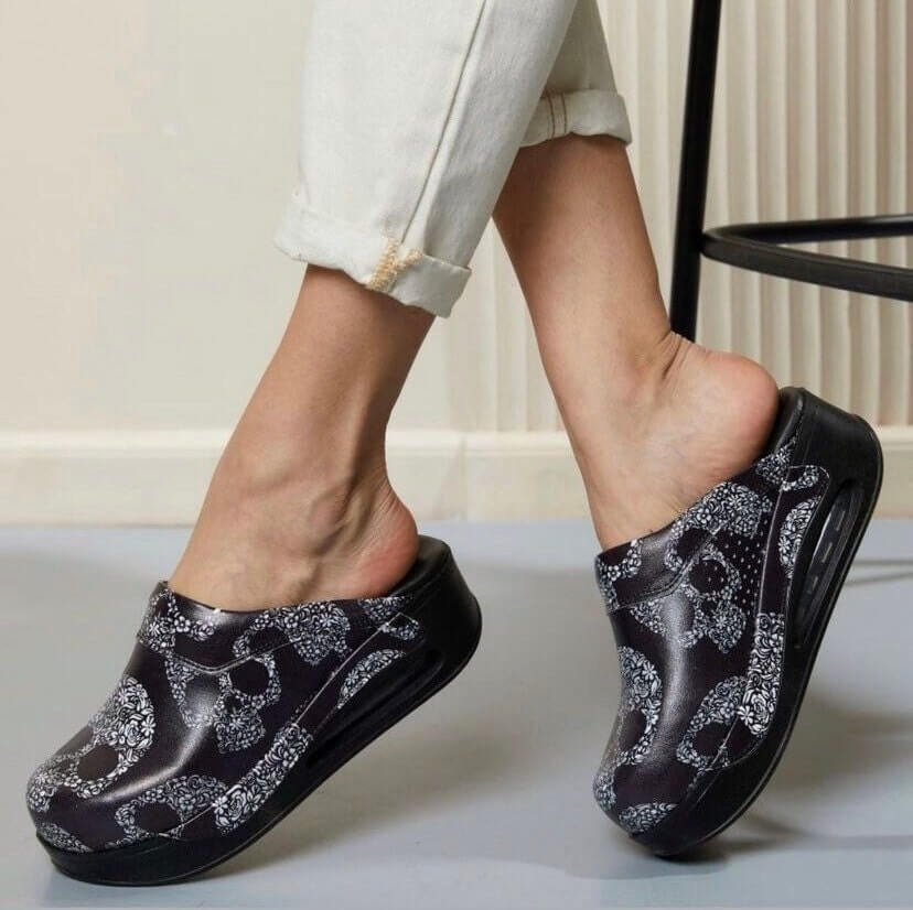 Front view of handmade skull design leather clogs with an Air Clogx sole