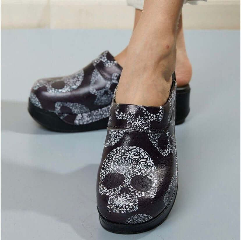 Handmade skull design leather clogs with an Air Clogx sole worn on the foot