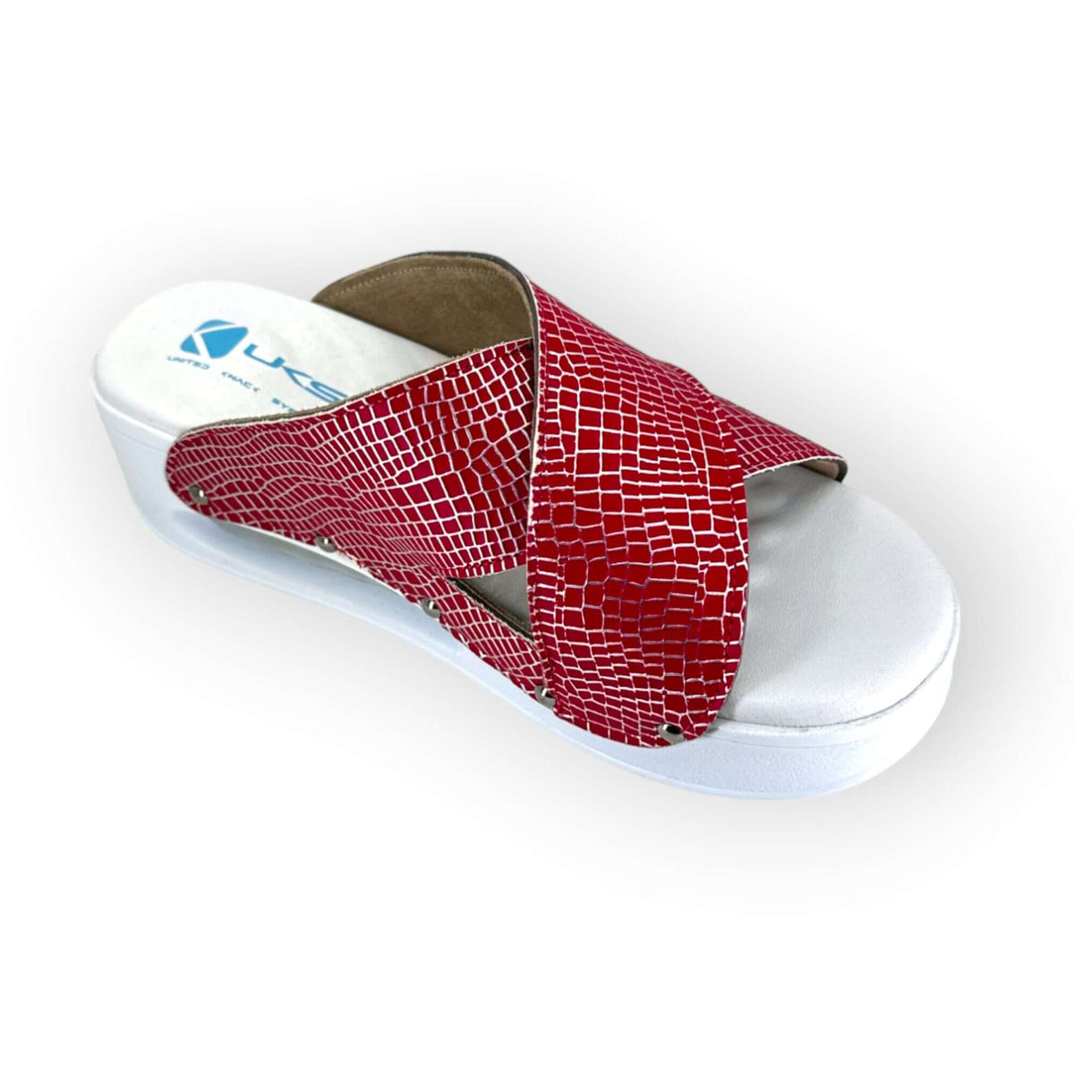 Strap and buckle detail on red and silver cross band leather clogs with an Air Clogx sole