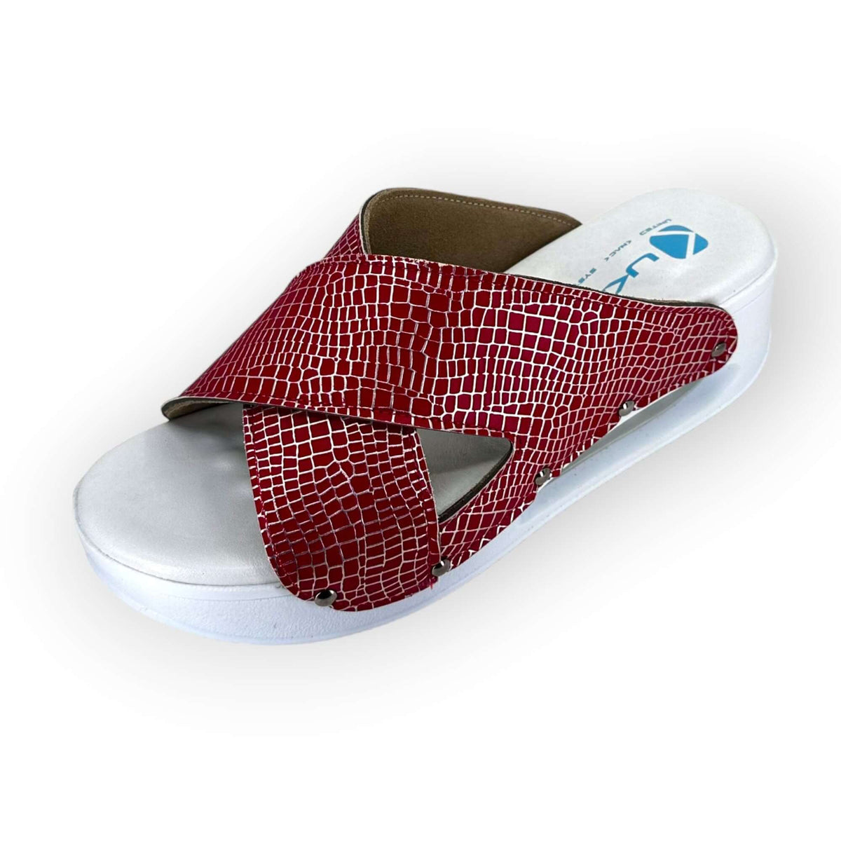 Angled three-quarter view of red and silver cross band leather clogs with an Air Clogx sole