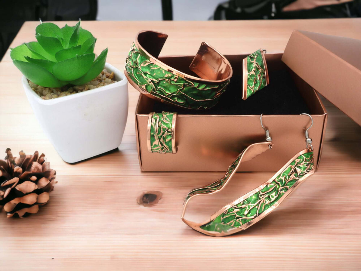 The full complete green wrinkled copper jewellery set laid flat