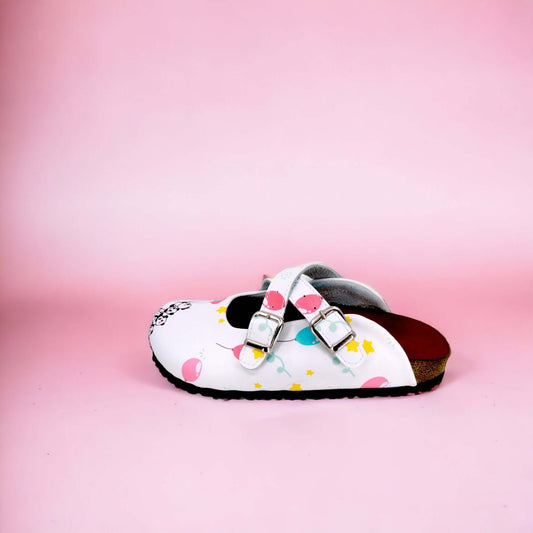 Side profile of orthopedic panda balloon cross band clogs with a cork sole