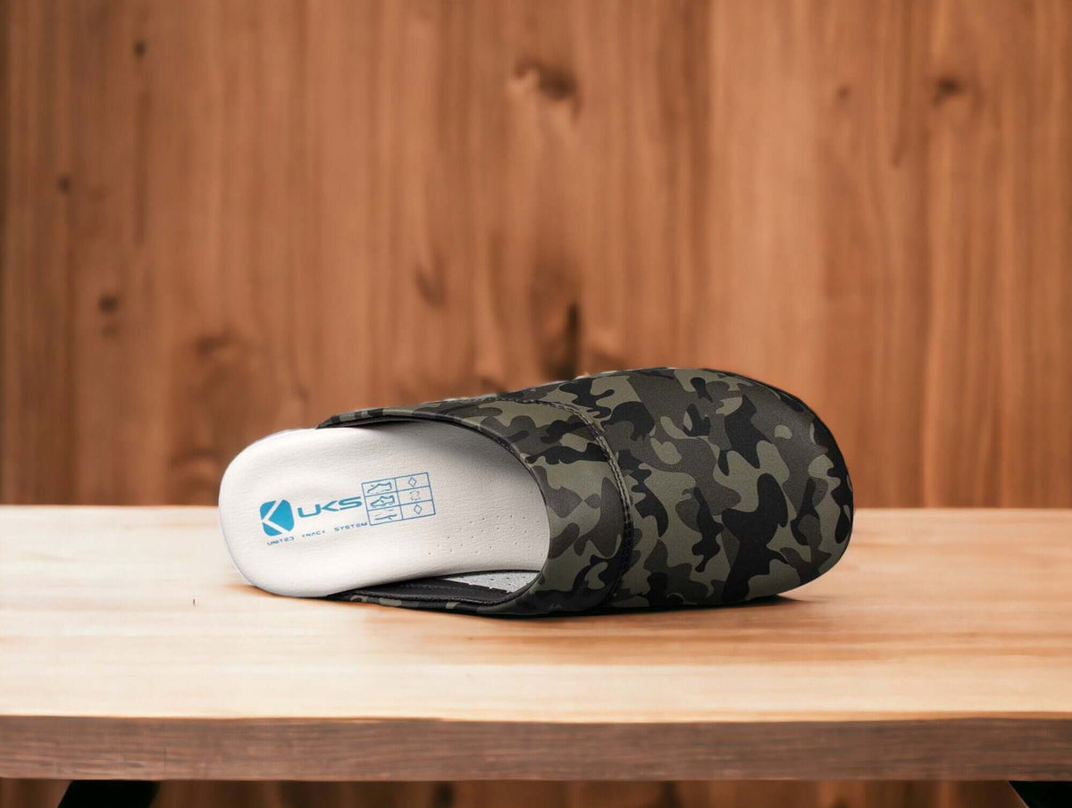 Side profile of camouflage leather clogs with a white Air Clogx sole